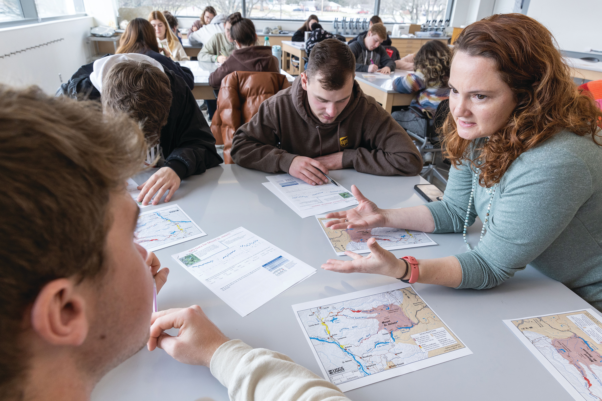 Professor reviewing material with students