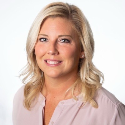 Headshot of Blonde woman in pink shirt