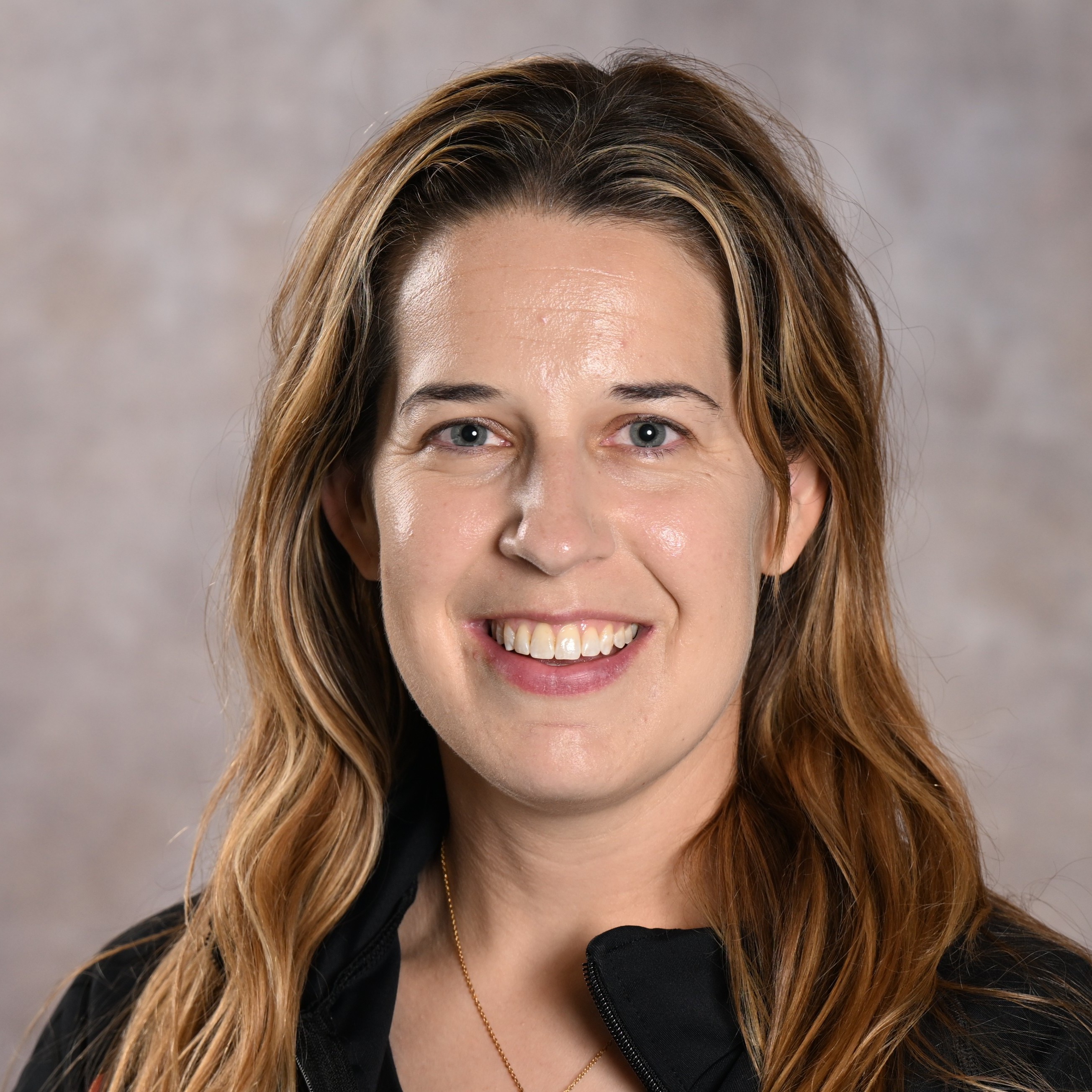 Headshot of a woman with light brown hair