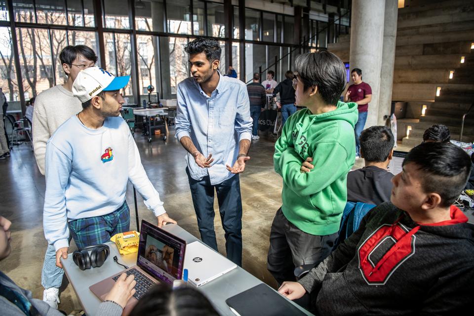 Group of students talking around a table