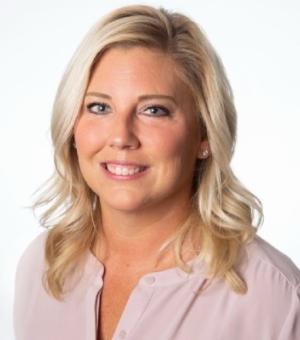 Headshot of Blonde woman in pink shirt