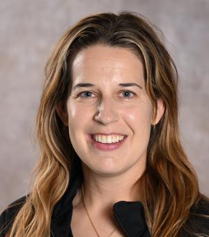 Headshot of a woman with light brown hair